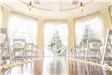 Indoor wedding ceremony with aisle decoration