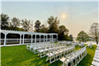 Outdoor wedding ceremony setting with pergola