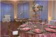 Round table with tall floral arrangement
