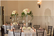 Round tables with tall floral arrangements