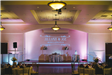 Stage décor at indoor wedding reception