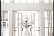 Bride standing in front of double doors