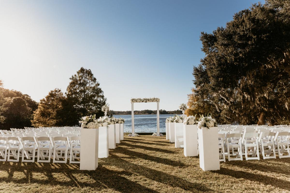 Outdoor wedding ceremony set up in front of water