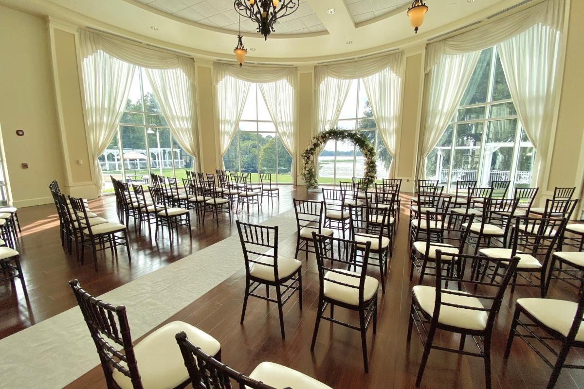 Indoor wedding set up in front of large window