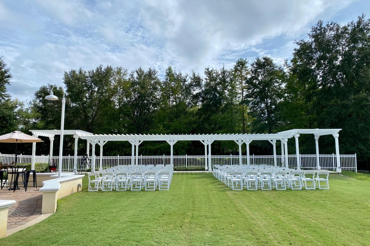 Outdoor wedding set up with a pergola