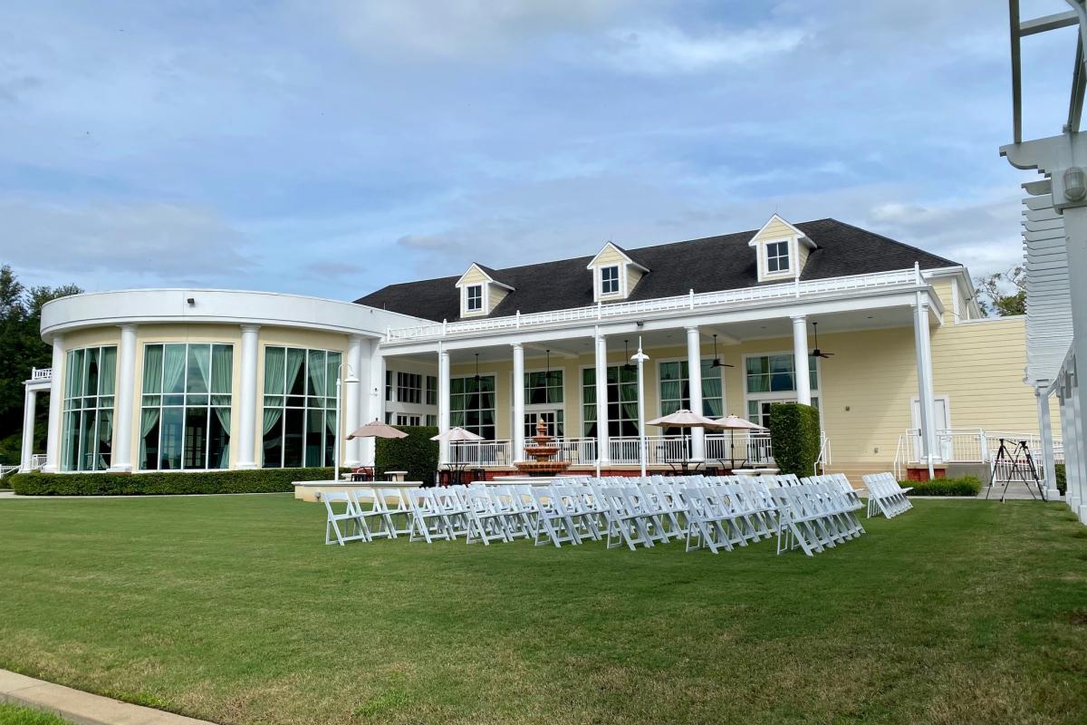 Outdoor wedding setting in front of building