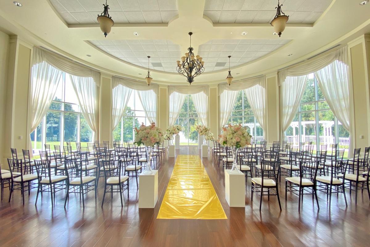 Indoor wedding setting with aisle runner