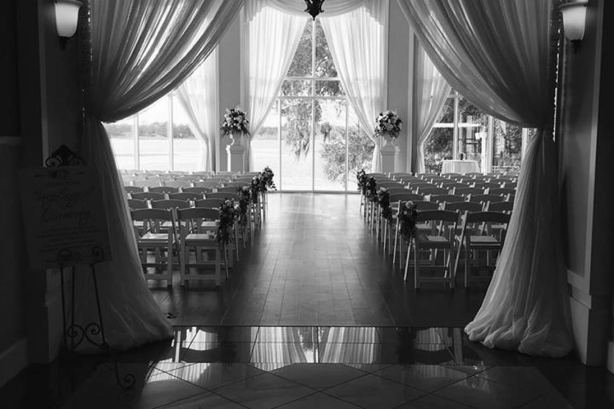 Black and white photo of indoor wedding set up