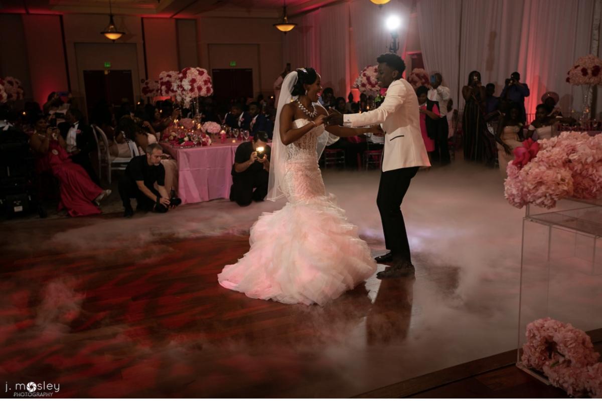 Bride and groom dancing at reception