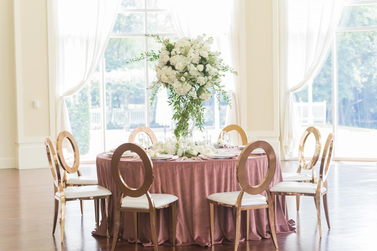 Large floral arrangement on a round table