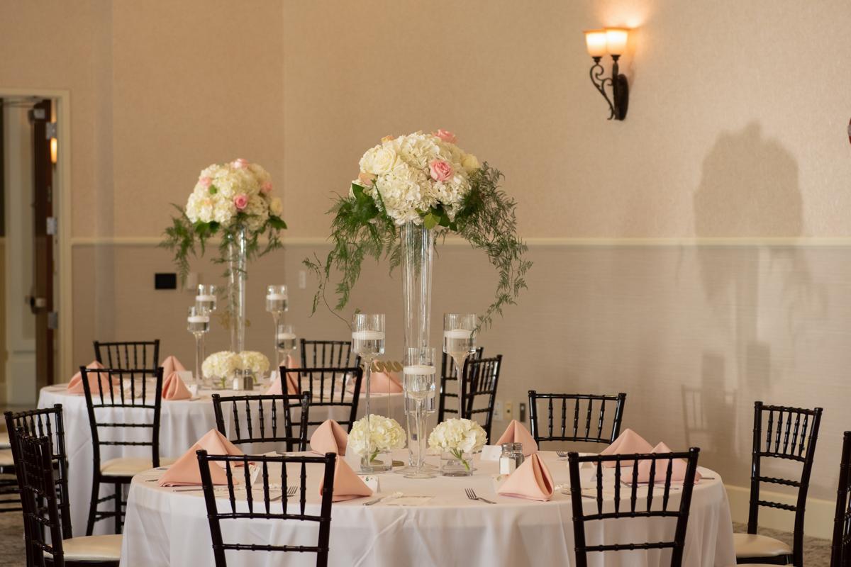 Round tables with tall floral arrangements