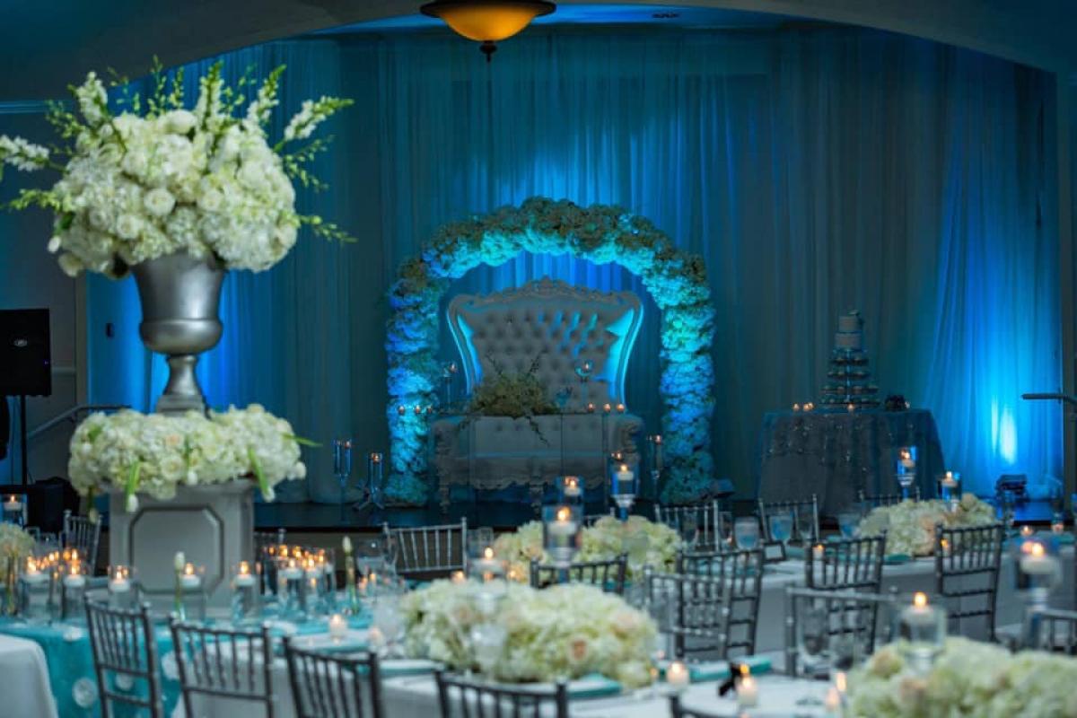 Large sofa with floral arch on stage
