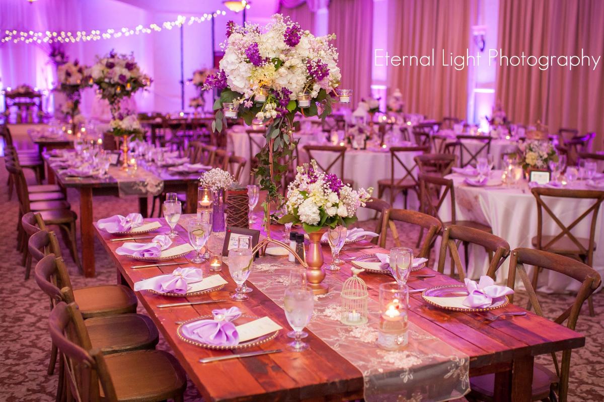 Square table with large floral arrangement