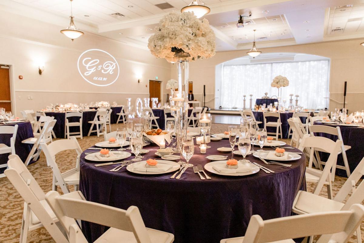 Round tables with tall floral arrangements