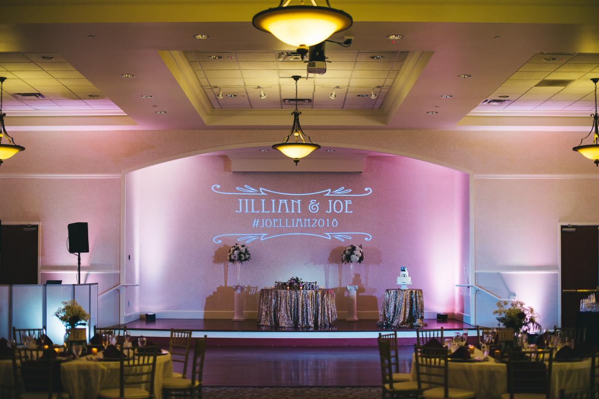Stage décor at indoor wedding reception